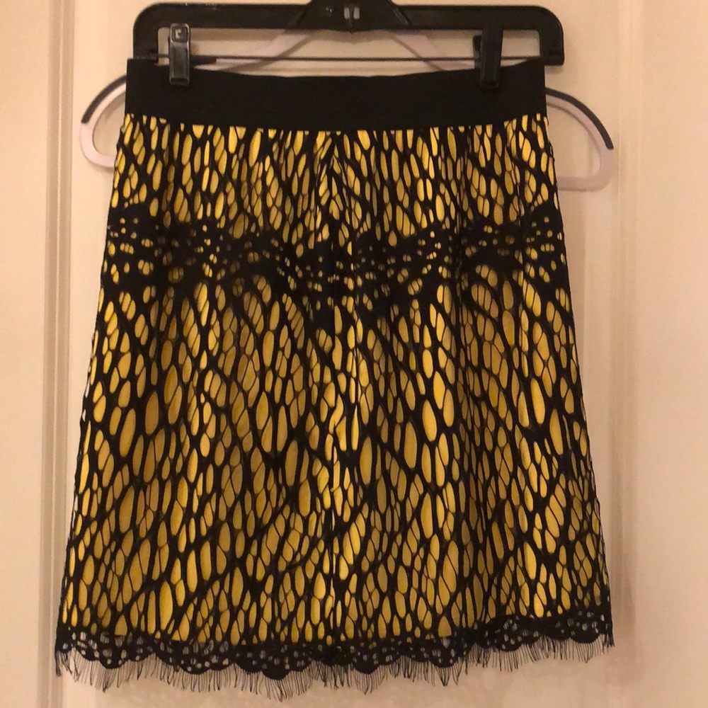 Never worn. Laser cut lace. Back zip.